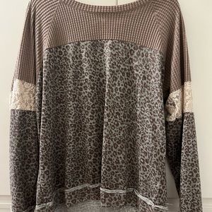 Long sleeved animal print and lace top
